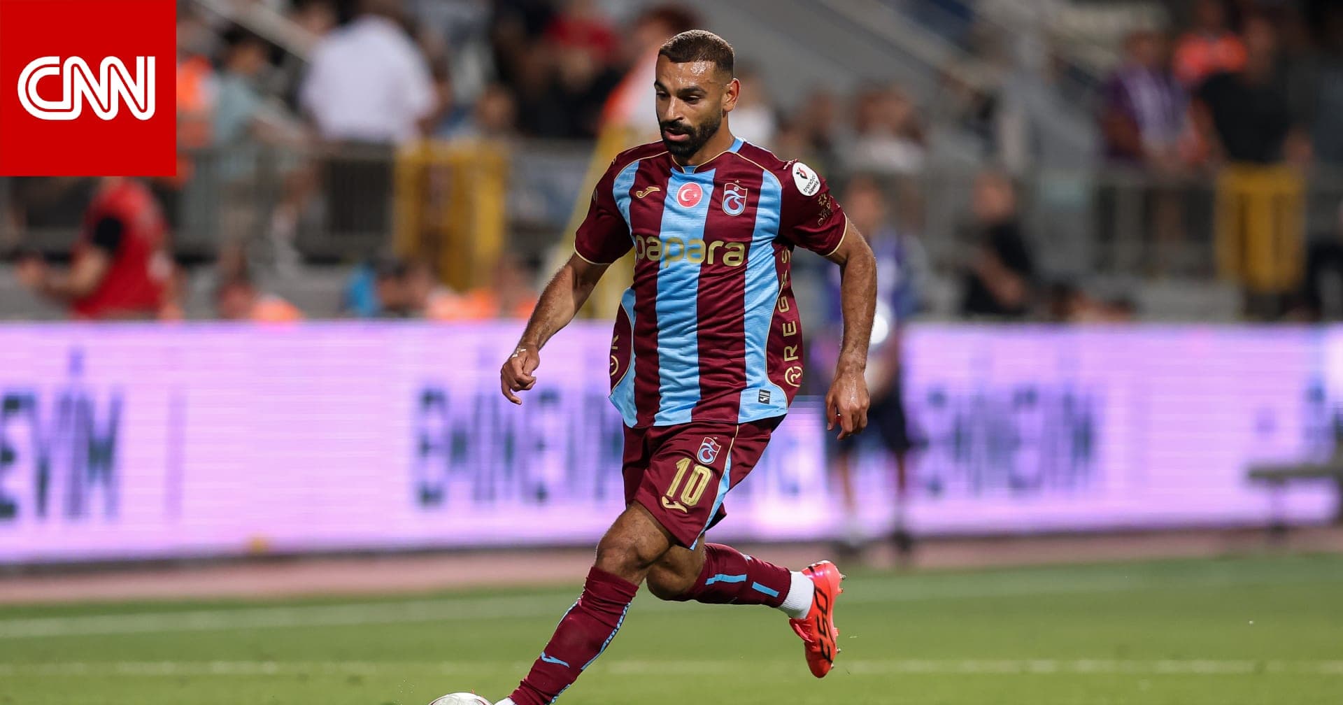 Mohamed Salah celebrates scoring two goals for Trabzonspor in the Turkish league